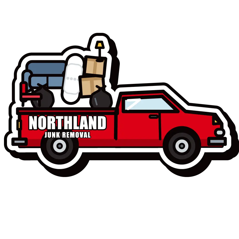 Northland Junk pickup truck loaded with a couch, boxes and trash bags